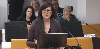 Sacha Lai-Svirk, volunteer board chair of the Peterborough Downtown Business Improvement Area (DBIA), addresses Peterborough city council during a meeting on December 1, 2025 to consider a proposed by-law that would see the City of Peterborough assume administrative control of a $150,000 annual payment from the city to the DBIA as part of a 20-year settlement agreement made in 2017. (kawarthaNOW screenshot of City of Peterborough video)