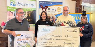 Craig McFarland of Linwood Homes (second from right) and Rotarians (left to right) Brent Perrin, Lyn Giles, and Amy Simpson with an $8,500 cheque for Five Counties Children's Centre at the Rotary Club of Peterborough's annual Christmas lunch at Northminster United Church on December 22, 2025. The Linwood Homes Fore The Kids Golf Tournament in September raised a total of $17,000, which was split equally between the Rotary Club and the regional children's treatment centre, which was originally conceived by Rotarians back in 1970. (Photo courtesy of Rotary Club of Peterborough)