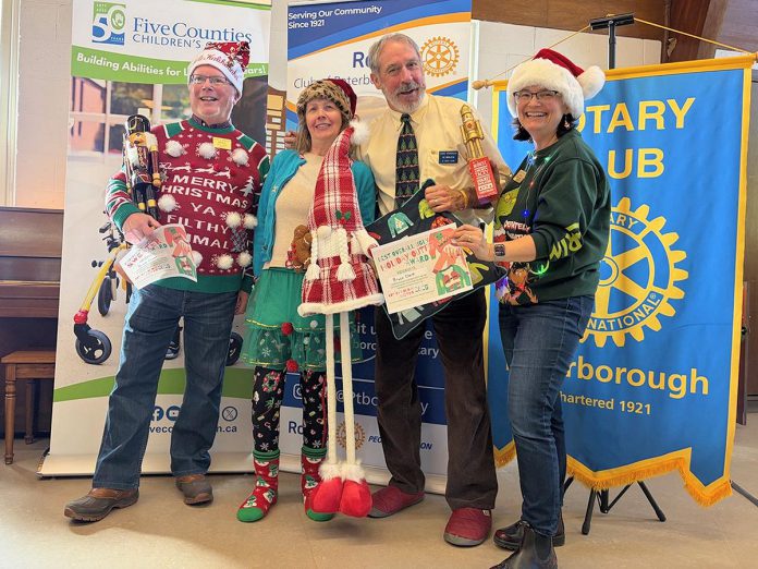 Rotarian Kelli Grady (right) organized the Rotary Club of Peterborough's Christmas sweater contest, with Rotarians (left to right) Bruce Gavel, Marie Press, and Bruce Clark announced as the winners at the Rotary Club of Peterborough's annual Christmas lunch at Northminster United Church on December 22, 2025. (Photo courtesy of Rotary Club of Peterborough)