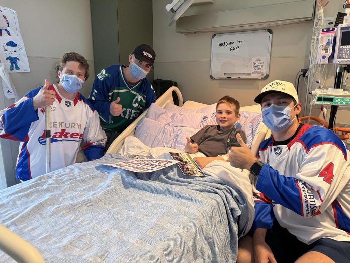 Peterborough Lakers players Adam Thistlethwaite, Nick Roode, and Colton Armstrong made a visit to patients at the Peterborough Regional Health Centre (PRHC) during the 2025 season. The Peterborough Century 21 Lakers were ambassadors for the hospital throughout the season, holding fundraisers in support of the PRHC Foundation's $70 million Campaign for PRHC, which includes bringing digital pathology to the regional hospital. (Photo courtesy of PRHC Foundation)