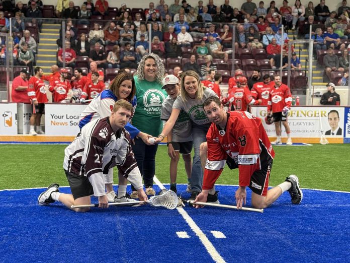 Peterborough Regional Health Centre (PRHC) Foundation president and CEO Lesley Heighway (left) helps drop the ball during the PRHC Family Night at a Peterborough Century 21 Lakers home game during the 2025 season. The team were ambassadors of the PRHC Foundation's $70 million Campaign for PRHC throughout the season, raising upwards of $15,000 through jersey auctions, merchandise sales, and other fundraising initiatives. (Photo courtesy of PRHC Foundation)