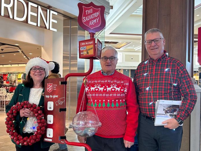 Peterborough city councillors Lesley Parnell (left) and Gary Baldwin (right) encouraged donations to The Salvation Army Peterborough at Lansdowne Place Mall during Celebrity Day on December 15, 2025. (Photo: The Salvation Army Peterborough / Facebook)
