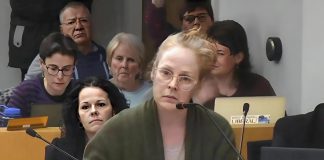 Sarah McNeilly reacts as councillor Lesley Parnell, who was chairing a public meeting under the Planning Act on February 24, 2025, tells her she is not allowed to speak to Mayor Jeff Leal's use of his strong mayor powers to expedite Brock Mission's proposed transitional housing project. The meeting, where the mayor's motion to expedite the project was approved by a one-third council vote, led to McNeilly forming the Northcrest Neighbours for Fair Process (NNFP) neighbourhood association, which launched an ultimately unsuccessful legal challenge of the mayor's decision that led to a settlement agreement where NNFP has agreed to pay $22,500 to the City of Peterborough and Brock Mission. (kawarthaNOW screenshot of City of Peterborough video)
