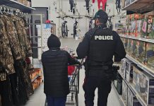 Supported by local businesses and community members, the Cobourg Police Service's annual "Shop with a Cop" program pairs children and youth in need with uniformed police officers, special constables, and auxiliary members for a festive shopping trip followed by lunch and a gift-wrapping session. (Photo: Cobourg Police Service)