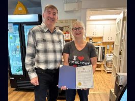 Peterborough-Kawartha MPP Dave Smith with Cheesy Fromage owner Tanya Bailey and her Rural Entrepreneur award from Ontario's Ministry of Rural Affairs. The Lakefield business owner was formally presented with the inaugural award as part of the first Rural Inspiration Awards event at the Rural Ontario Municipalities Association (ROMA) conference in Toronto on January 19, 2026. (Photo: Office of Dave Smith)