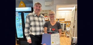 Peterborough-Kawartha MPP Dave Smith with Cheesy Fromage owner Tanya Bailey and her Rural Entrepreneur award from Ontario's Ministry of Rural Affairs. The Lakefield business owner was formally presented with the inaugural award as part of the first Rural Inspiration Awards event at the Rural Ontario Municipalities Association (ROMA) conference in Toronto on January 19, 2026. (Photo: Office of Dave Smith)