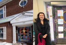 Artist Mickaela Baker with the mural she created on both sides of the entrance to the Canadian Mental Health Association Haliburton, Kawartha, Pine Ridge (CMHA HKPR) office at 466 George Street North in downtown Peterborough. CMHA HKPR comessioned the work with the purpose of creating a welcoming and inclusive entryway for people accessing mental health care. (Photos courtesy of CMHA HKPR)