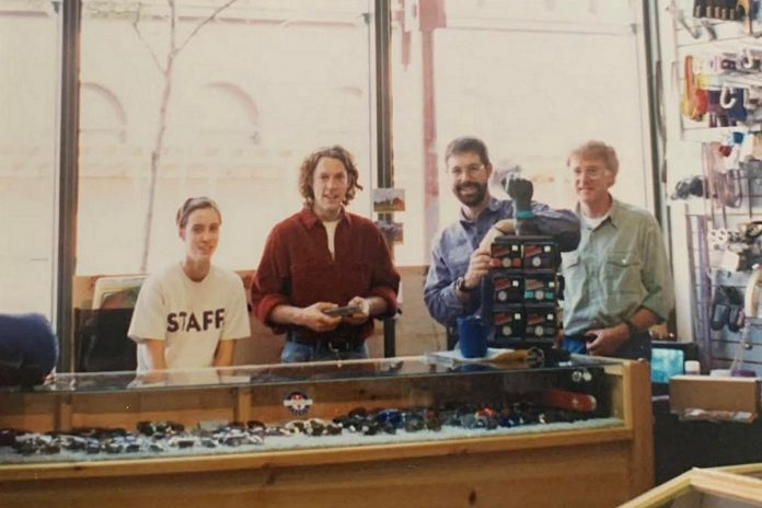 Wild Rock Outfitters co-founders Kieran Andrews and Scott Murison (second and third from left) with Kieran's father Chris (right) at the outdoor gear retailer's original location on George Street in downtown Peterborough in the 1990s. In honour of Chris, who passed away in summer 2025, Andrews matched all donations made to Wild Rock's ComPassion Project throughout November 2025 up to $20,000, helping to raise over $39,000 for six local organizations focused on environmental stewardship and positive social change. (Photo courtesy of Wild Rock Outfitters)