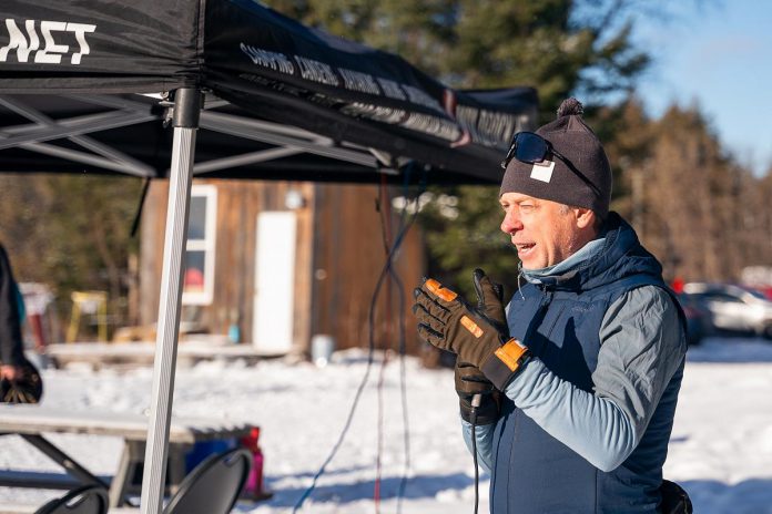Kieran Andrews, founder of the ComPassion Project and co-founder of Wild Rock Outfitters, addresses participants at the annual 8-Hour Ski Relay, hosted by the Kawartha Nordic Ski Club in North Kawartha Township on January 26, 2025 in support of the ComPassion Project. Now called the Kawartha Nordic ComPassion Relay, the event returns to Kawartha Nordic on January 31, 2026 with the goal of raising $26,000. (Photo: Jeff Faulds Photography)