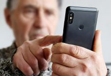 Cobourg police remind public to be vigilant after 82-year-old man nearly loses savings in bank investigator scam An elderly man using a cell phone. (Stock photo)