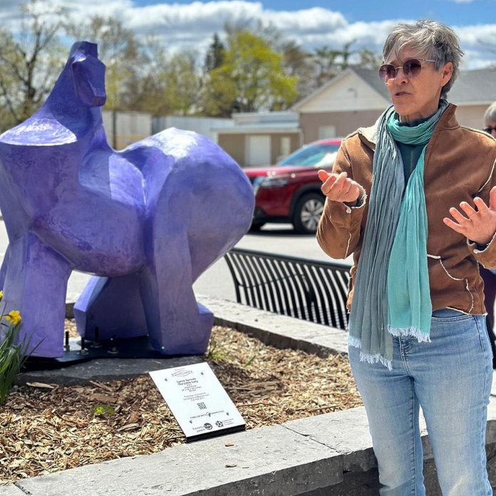Lynne Sproule speaks about her sculpture "The Little Lady" (2025, winterstone) during the public launch of the 2025 Downtown Sculpture Exhibition led by the Fenelon Arts Committee. After selections are made for the 2026 public art exhibition, there will be a public launch and walking tour held at 11 a.m. on May 8, 2026 at the Colborne Street Gallery. (Photo: Fenelon Arts Committee / Facebook)