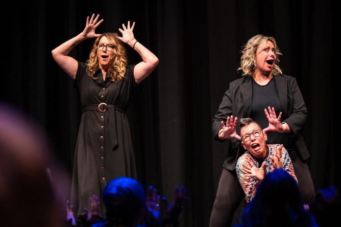 Diana Frances, Jennine Profeta, and Elvira Kurt performing on stage during Girls Nite Out, an all-female comedy show returning to Market Hall Performing Arts Centre in Peterborough on January 16, 2026. The show begins with stand-up comedy by Kurt, followed by improv games and a "talk show" that invites audience members to share their humorous or touching anecdotes in a safe space. (Photo: Dahlia Katz)