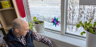 Lower your heating bills and stay warm by sealing air leaks in your home GreenUP energy advisor Bryn Magee points to an electrical outlet on an exterior wall in the GreenUP office. In many older buildings, electrical outlets are sources of air leakage. Foam gaskets and plug protectors can help to staunch the flow of cold air. (Photo: Clara Blakelock / GreenUP)