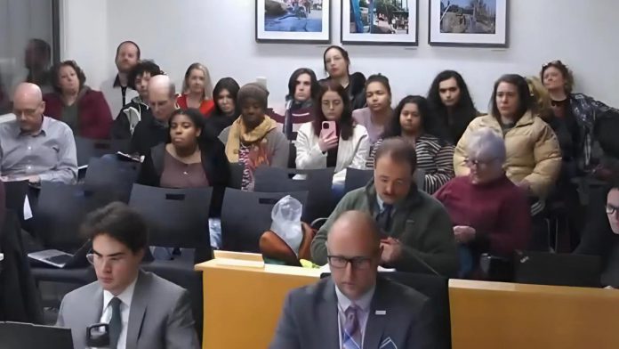 Members of Peterborough's Black community were in the gallery during a city council meeting on January 12, 2026, where a report from the city's integrity commissioner on Mayor Jeff Leal's use of an anti-Black racial slur was tabled. Responding to the findings of the report, councillor Alex Bierk put forward a motion to mandate anti-racism training for all councillors and city staff as well as to amend the code of conduct and the city's strategic plan. (kawarthaNOW screenshot of City of Peterborough video)