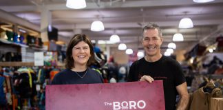 Katy Shufelt, pictured with Scott Murson of Wild Rock Outfitters, won the grand prize draw of $1,500 in Boro gift cards as part of the annual Holiday Shopping Passport program organized by the Peterborough Downtown Business Improvement Area (DBIA). Shufelt is donating a portion of her prize to Wild Rock's ComPassion Project, which raises funds and awareness for six local organizations working on the front lines of social and environmental change. (Photo: Peterborough DBIA)