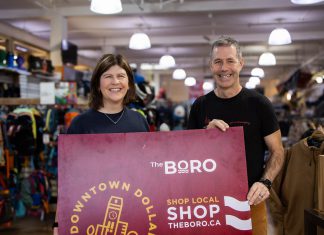 Katy Shufelt, pictured with Scott Murson of Wild Rock Outfitters, won the grand prize draw of $1,500 in Boro gift cards as part of the annual Holiday Shopping Passport program organized by the Peterborough Downtown Business Improvement Area (DBIA). Shufelt is donating a portion of her prize to Wild Rock's ComPassion Project, which raises funds and awareness for six local organizations working on the front lines of social and environmental change. (Photo: Peterborough DBIA)