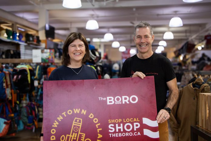 Katy Shufelt, pictured with Scott Murson of Wild Rock Outfitters, won the grand prize draw of $1,500 in Boro gift cards as part of the annual Holiday Shopping Passport program organized by the Peterborough Downtown Business Improvement Area (DBIA). Shufelt is donating a portion of her prize to Wild Rock's ComPassion Project, which raises funds and awareness for six local organizations working on the front lines of social and environmental change. (Photo: Peterborough DBIA) Katy Shufelt, pictured with Scott Murson of Wild Rock Outfitters, won the grand prize draw of $1,500 in Boro gift cards as part of the annual Holiday Shopping Passport program organized by the Peterborough Downtown Business Improvement Area (DBIA). Shufelt is donating a portion of her prize to Wild Rock's ComPassion Project, which raises funds and awareness for six local organizations working on the front lines of social and environmental change. (Photo: Peterborough DBIA)