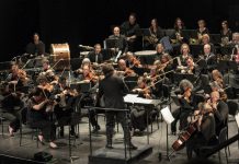 Michael Newnham conducting the Peterborough Symphony Orchestra (PSO) during the sold-out "Popcorn, Please!" concert in 2024. Newnham and the PSO return to Showplace Performance Centre in downtown Peterborough on February 7 and 8, 2026 for "Stars of the Silver Screen," the orchestra's third annual film music concert, this time featuring music from films of the 1960s including James Bond, The Pink Panther, Psycho, The Sound of Music, and many more. Audiences are encouraged to help set the mood by dressing in their favourite '60 outfits. (Photo courtesy of the PSO)