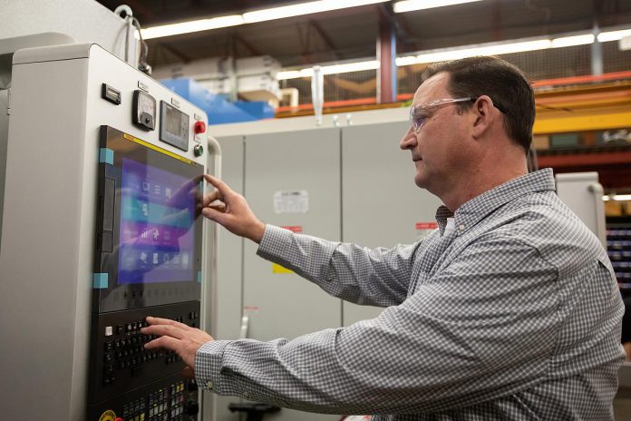 Operations manager Dave Strain says, while Quickmill's machines rarely go down, the company's service team can quickly a customer's machine back up and running before it can affect their operations. (Photo: Jordan Lyall Photography)
