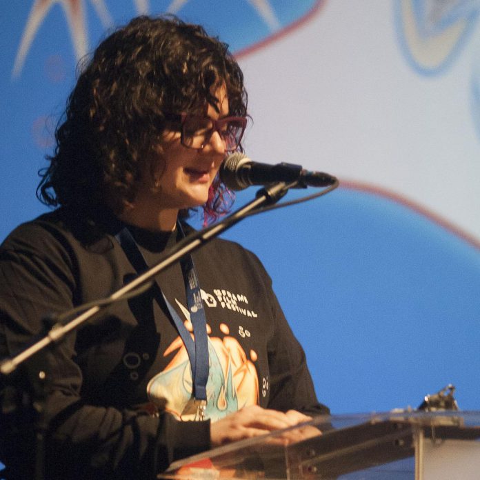 Eryn Lidster, creative director of the ReFrame Film Festival, speaks to the audience at the opening of the 20th annual documentary film festival in 2024. With the help of a volunteer programming advisory committee, Lidster curated the lineup of more than 40 social and environmental justice documentaries that will be screened during the 2026 ReFrame Film Festival from January 30 to February 8. (Photo: Esther Vincent, courtesy of ReFrame Film Festival)