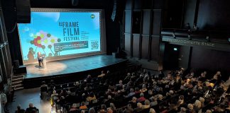 The audience at Showplace Performance Centre in downtown Peterborough during the 2025 ReFrame Film Festival. According to the festival's executive director Kait Dueck, ReFrame brings people together for thought-provoking shared experiences that can help counter physical and emotional isolation during what is figuratively and literally the darkest time of the year. The 2026 festival runs in-person in downtown Peterborough from January 30 to February 1 and online across Canada from February 3 to 8. (Photo courtesy of ReFrame Film Festival)
