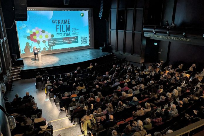 The audience at Showplace Performance Centre in downtown Peterborough during the 2025 ReFrame Film Festival. According to the festival's executive director Kait Dueck, ReFrame brings people together for thought-provoking shared experiences that can help counter physical and emotional isolation during what is figuratively and literally the darkest time of the year. The 2026 festival runs in-person in downtown Peterborough from January 30 to February 1 and online across Canada from February 3 to 8. (Photo courtesy of ReFrame Film Festival)