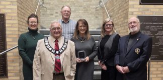 Stephanie Jukes (middle) accepting the Osprey Heritage Award for Heritage Restoration/Adaptive Reuse for the Saucy Willow Inn in Coboconk at Kawartha Lakes City Hall on January 13, 2026. Stephanie and her husband David (not pictured) purchased the historic 1878 building in 2021 and have since restored it. (Photo courtesy of City of Kawartha Lakes)