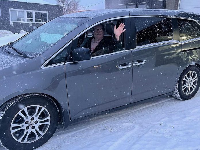 One of the volunteer drivers for Bancroft Community Transit (BCT) waves from "Caleb the Honda" on its first day of operation after the vehicle was donated to the non-profit organization by the Mourtzanos family. The donation of the minivan not only supports the organization's transportation services, but it has given hope to BCT as it facing challenges to replace its aging vehicles. (Photo courtesy of BCT)
