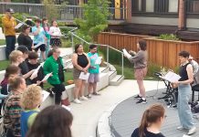 Volunteer-led organization Big Sing Nogojiwanong-Peterborough leads a community of singers of all ages and skill levels during the first free group choir event held on June 14, 2025 at the Jalynn Bennett Amphitheatre at Trent University's Traill College. The organization was formed to provide a free, inclusive, and informal space for community members to connect and engage in song. The group will be singing "Defying Gravity" on March 6, 2026 at 7 p.m. at Peterborough Square. (Photo courtesy of Big Sing Nogojiwanong-Peterborough)