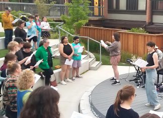 Big Sing Nogojiwanong-Peterborough invites community to raise their voices together Volunteer-led organization Big Sing Nogojiwanong-Peterborough leads a community of singers of all ages and skill levels during the first free group choir event held on June 14, 2025 at the Jalynn Bennett Amphitheatre at Trent University's Traill College. The organization was formed to provide a free, inclusive, and informal space for community members to connect and engage in song. The group will be singing "Defying Gravity" on March 6, 2026 at 7 p.m. at Peterborough Square. (Photo courtesy of Big Sing Nogojiwanong-Peterborough)