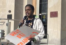 Charmaine Magumbe, chairperson of the Community Race Relations Committee of Peterborough and co-founder of the Afrocentric Awareness Network of Peterborough, addresses the crowd at Peterborough City Hall on April 28, 2025 during a protest of Mayor Jeff Leal's use of a racial slur while giving a guest lecture at Trent University. (Photo: Paul Rellinger / kawarthaNOW)