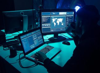 Lakelands Public Health says 60,000 Peterborough-area residents may be affected by January cybersecurity incident A hacker with a laptop and a secondary monitor showing data. (Stock photo)