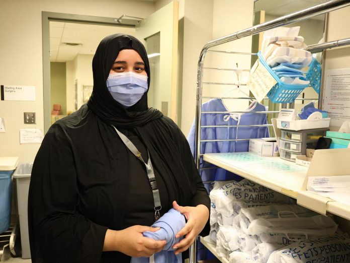 High volunteer rates are consistently associated with stronger social networks, higher capacity to support vulnerable populations, and increased community resilience during times of crisis. Surgical outpatient volunteers like Haniya Fazli greet patients at Peterborough Regional Health Centre before their procedures offering pre-surgical compassion, reassurance, and guidance. (Photo: Natasha Roulston / Peterborough Regional Health Centre)
