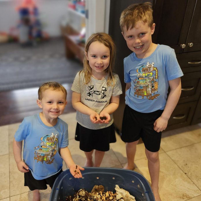Worm parenting made easy: young composters care for a worm bin, turning food scraps into nutrient-rich compost while learning about sustainability. Teaching children to value the environment early helps foster lifelong stewardship. (Photo: Callie Downer / Our Little Wormery)