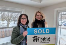 Habitat for Humanity Northumberland CEO Cathy Borowec with Anna, a single mother who was approved for the organization's affordable homeownership program in 2020, during a dedication and key ceremony on February 19, 2026 at a renovated home on Pinnacle Street South in Brighton. After six years, Anna and her daughter Emilia will soon be moving into the home, which was previously occupied by another Habitat family. (Photo courtesy of Habitat for Humanity Northumberland)