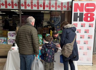 A member of the Peterborough Police Service at a booth during Family Literacy Day at Peterborough Square on January 24, 2026 sharing information with the community about the refreshed N0H8 ("No Hate") public education and awareness campaign. The campaign aims to bring awareness to hate and bias incidents and to provide resources on how such incidents can be reported. (Photo: Peterborough Police Service)