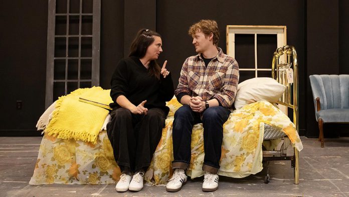 Carling Dulder as Anna and Eddy Sweeney as Wesley recalling the life-defining moments of their high school years during a rehearsal of the Peterborough Theatre Guild's production of "Midnight Madness" by award-winning Peterborough-born playwright Dave Carley. Directed by Jane Werger and produced by Diane Théberge, the heartfelt comedy runs for 10 performances from February 27 to March 14, 2026. (Photo: Jordan Lyall Photography)