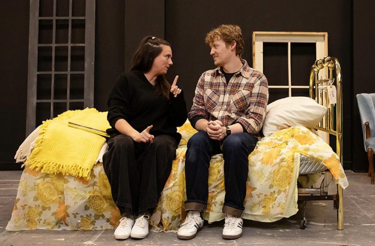Carling Dulder as Anna and Eddy Sweeney as Wesley recalling the life-defining moments of their high school years during a rehearsal of the Peterborough Theatre Guild's production of "Midnight Madness" by award-winning Peterborough-born playwright Dave Carley. Directed by Jane Werger and produced by Diane Théberge, the heartfelt comedy runs for 10 performances from February 27 to March 14, 2026. (Photo: Jordan Lyall Photography)