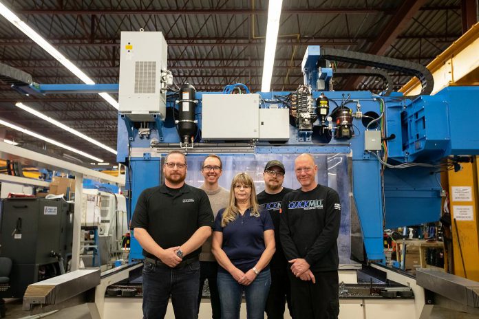 Quickmill is supported by expert sales, engineering, manufacturing, and service teams that work together to supply the company's customers with the best in large-scale industrial machining solutions. Pictured are Regional Sales Manager Phil Green, Mechanical Designer Simon Peacock, Service Coordinator/Office Administrator Erin Ham, CNC Service Technician Dave Guilbeault, and Mechanical Assembler Al Hill. Poised for growth, Quickmill is actively hiring for manufacturing and customer support roles in February 2026. (Photo: Jordan Lyall Photography)