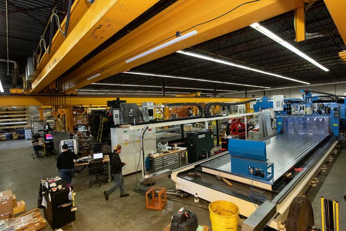 View of CNC drilling and milling machines being assembled at Quickmill's Peterborough facility. With the company expanding into new markets like Mexico to diversify its growth strategy, Quickmill is also exploring options to expand its production capacity to build more and larger machines. (Photo: Jordan Lyall Photography)