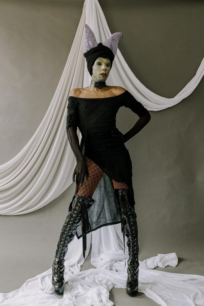 Sahira the Djinn as Maleficent from "Sleeping Beauty" for Heather Doughty's "Villains" project, launching on March 6, 2026 at her downtown Peterborough studio. Though she initially planned to create each character's world as their background, Doughty eventually decided to give them a very minimalistic set so that the focus is the woman and the story they are telling. (Photo: Heather Doughty Photography)