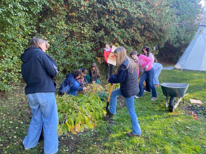 Students of the Youth Leadership in Sustainability (YLS) program collaborate with the Trent University School of Education to replace non-native garden plants with native plants. Graduates of the integrated curriculum program are often inspired to pursue post-secondary studies and careers in related fields. (Photo courtesy of YLS)