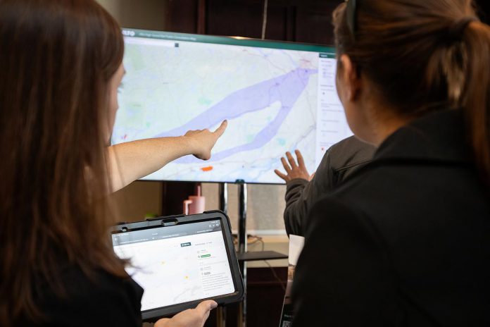 An Alto team member points to a map of the possible corridor between Ottawa and Toronto during an open house on the proposed high-speed rail network held at the McDonnel Street Activity Centre in Peterborough on February 26, 2026. (Photo: Jordan Lyall / kawarthaNOW)