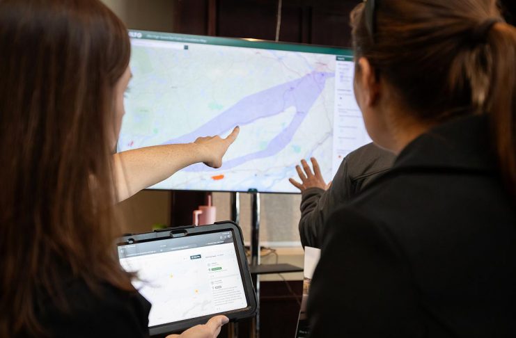 An Alto team member points to a map of the possible corridor between Ottawa and Toronto during an open house on the proposed high-speed rail network held at the McDonnel Street Activity Centre in Peterborough on February 26, 2026. (Photo: Jordan Lyall / kawarthaNOW)