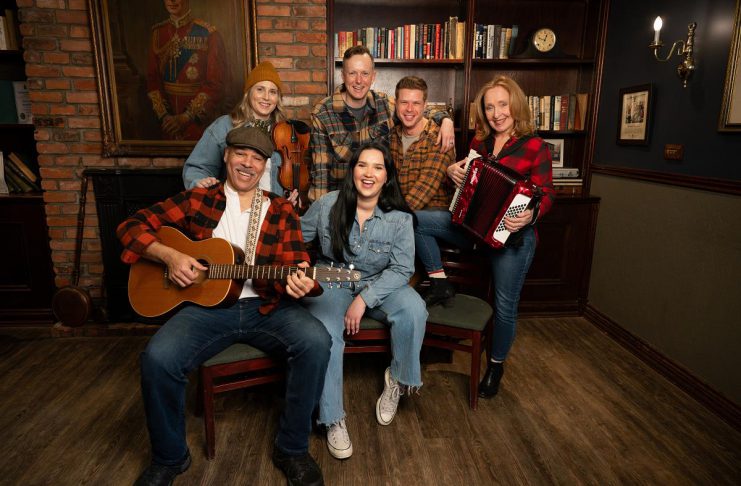 The cast of the Capitol Theatre's production of the Broadway smash-hit musical "Come From Away," which runs from July 10 to August 2, 2026 at the historic venue in Port Hope, includes (front) Beau Dixon and Julie Lumsden and (back) Melissa Payne, Kyle Blair, Kyle Golemba, and Donna Garner. (Photo: Sam Moffatt)