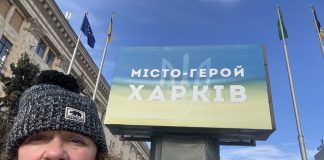 Peterborough native Chloë Black in front of a sign that reads "Hero City Kharkiv" during her sixth trip to Ukraine since Russia launched its full-scale invasion in 2022. Black is currently in Kharkiv volunteering with a local animal shelter and will soon be returning to Kyiv to support the Ukrainian Patriot organization in helping children who have been impacted by the war. (Photo: Chloë Black)