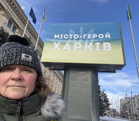 Peterborough native Chloë Black in front of a sign that reads "Hero City Kharkiv" during her sixth trip to Ukraine since Russia launched its full-scale invasion in 2022. Black is currently in Kharkiv volunteering with a local animal shelter and will soon be returning to Kyiv to support the Ukrainian Patriot organization in helping children who have been impacted by the war. (Photo: Chloë Black)