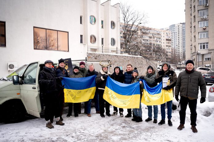 When entering Ukraine on what is her sixth humanitarian trip to the war-town country, Peterborough native Chloë Black (fourth from right) connected with an organization that brings vehicles that have been donated or purchased from across Europe to the country. After driving from Copenhagen to Kyiv, she met with a battalion to pass along the vehicle to use in defence efforts. (Photo courtesy of Chloë Black)
