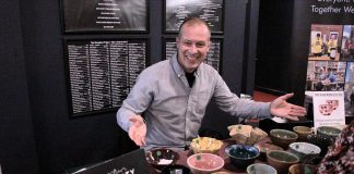 Empty Bowls fundraiser raises over $15,000 for One City Peterborough’s daily meal program Michael VanDerHerberg of One City Peterborough shows off some of the handmade artisanal bowls donated by members of the Kawartha Potters Guild for the annual Empty Bowls fundraiser on February 27, 2026 at Showplace Performance Centre, where 180 attendees selected a bowl of their choice and sampled food donated by 11 local restaurants. (Photo: One City Peterborough)