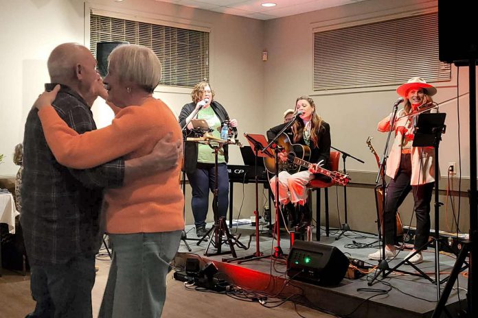 Mike and Clare Sullivan, parents of the late Erin Sullivan, dance to live music during the first annual Erin's House fundraiser held in 2024. The annual celebratory event of music, stories, and dance has helped to raise the remaining balance, which now stands at just under $137,000, of One City Peterborough's Erin Sullivan House, providing affordable housing for those coming out of homelessness. (Photo: Jessica Carroll)